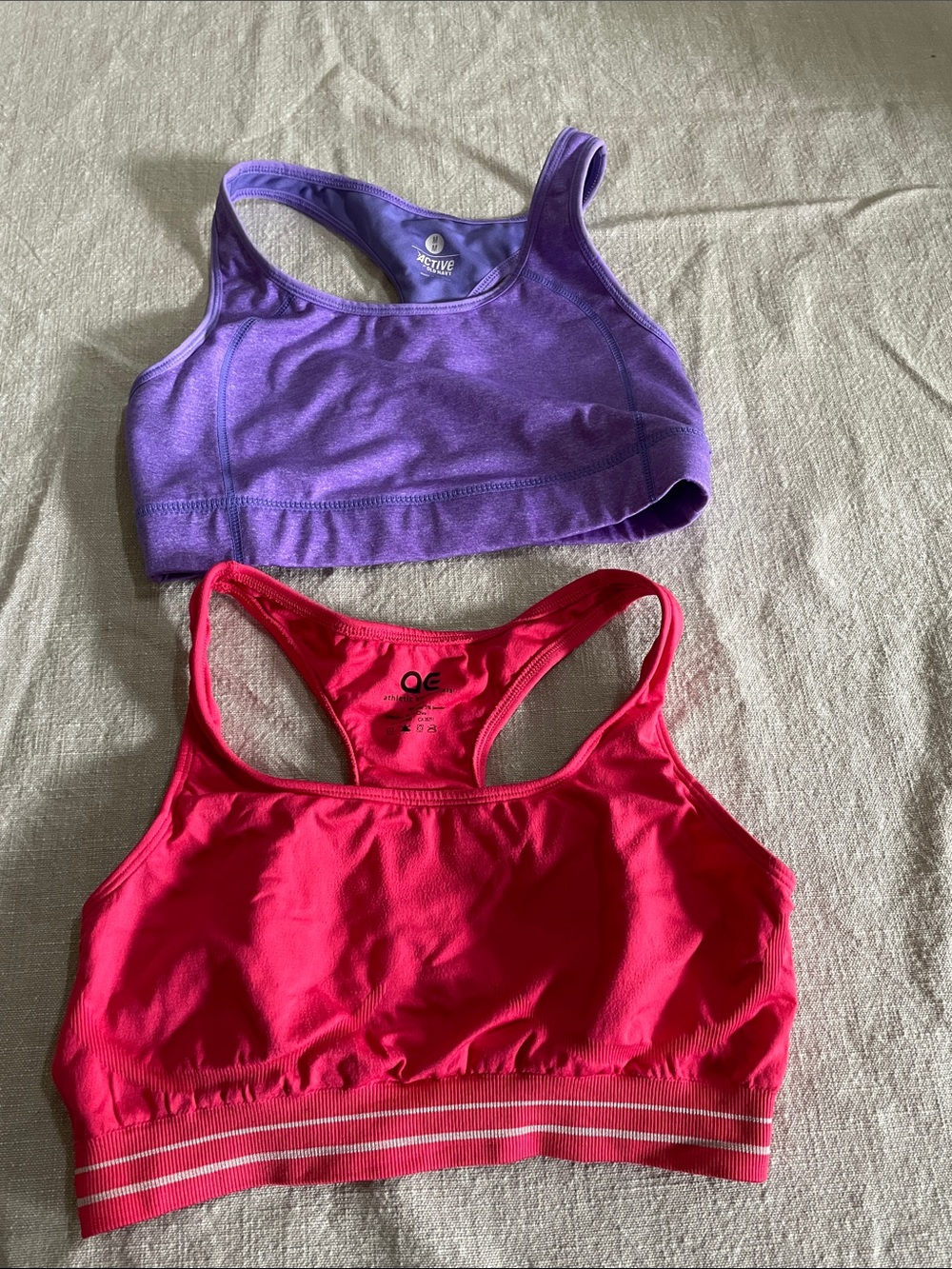 2 pack of women’s medium, colorful Racerback Sports Bras - pink and purple